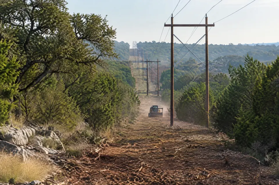 Right-of-way clearing in Texas: freshly mulched power line right-of-way running over a cedar-covered ridge